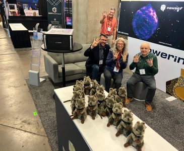 Mark Stickells, Ann Backhaus, Maciej Cytowsci and Ugo Varetto, at our booth in SC22 Dallas, while our Quokkas are displayed drawing a number four because our ranking in the Green500