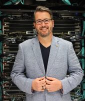 Mark Stickells in front of Setonix Supercomputer